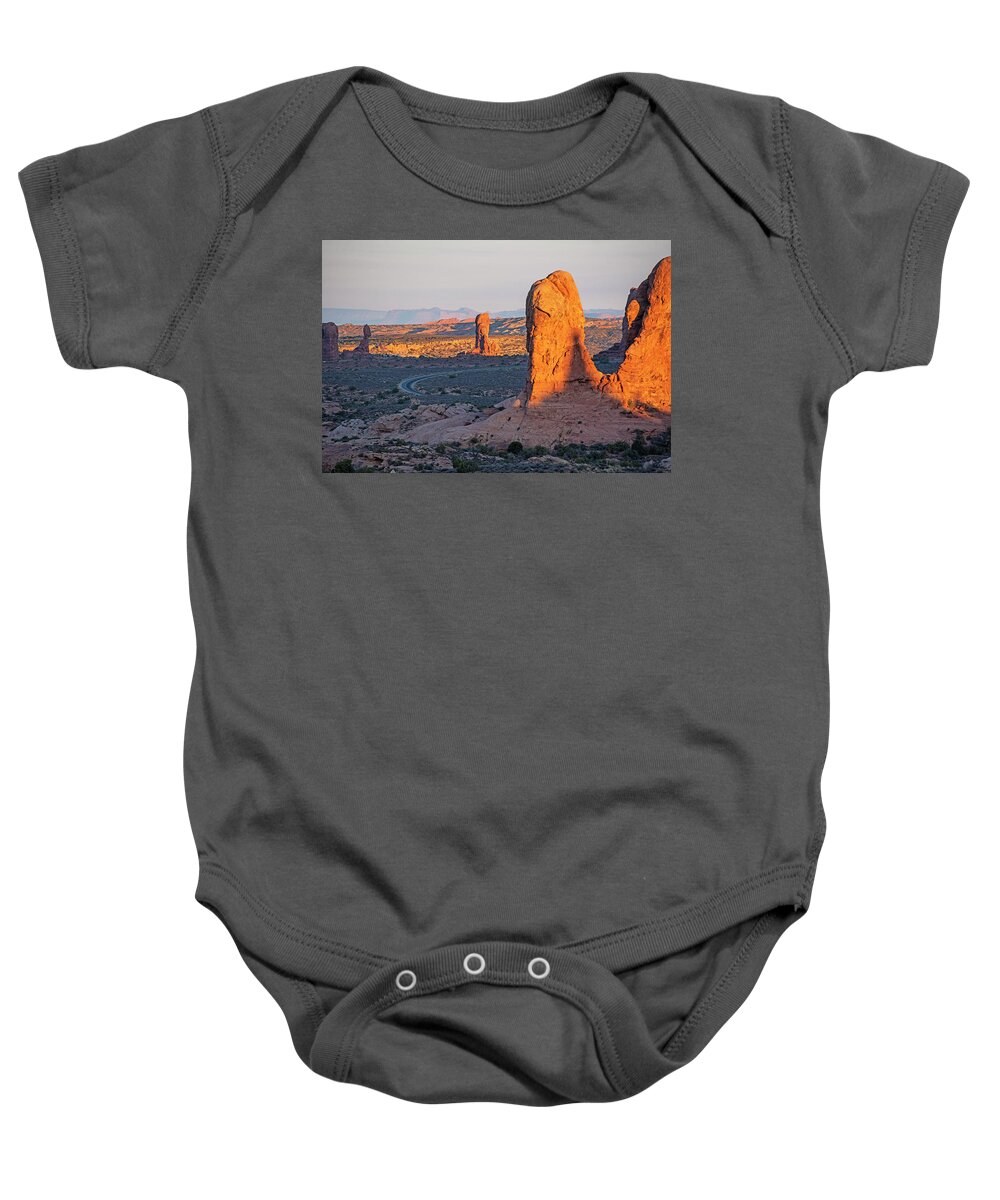 Arches Baby Onesie featuring the photograph Looking down on Arches National Park in Moab Utah by Toby McGuire