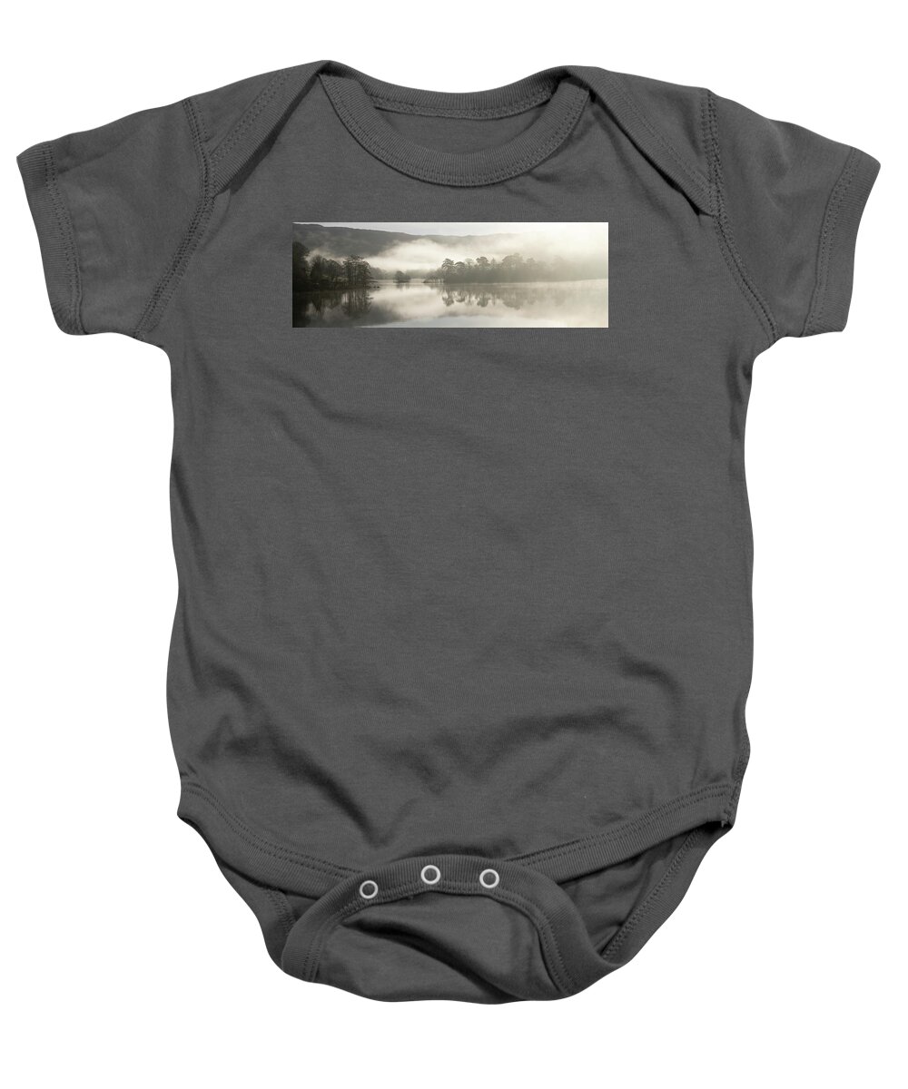 Panorama Baby Onesie featuring the photograph Misty rydal water reflections lake district by Sonny Ryse