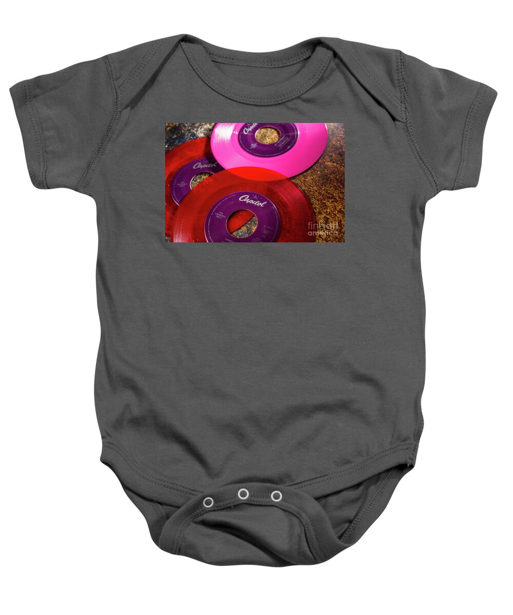 1960s Baby Onesie featuring the photograph Multi-colored vinyl records by Joaquin Corbalan