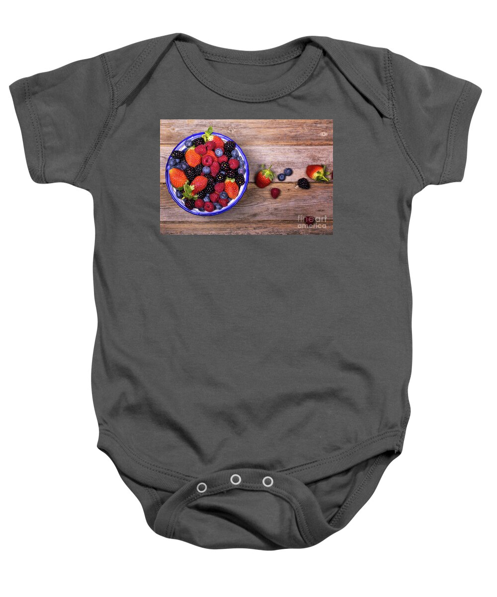 Background Baby Onesie featuring the photograph Overhead view of summer fruits in a bowl by Jane Rix