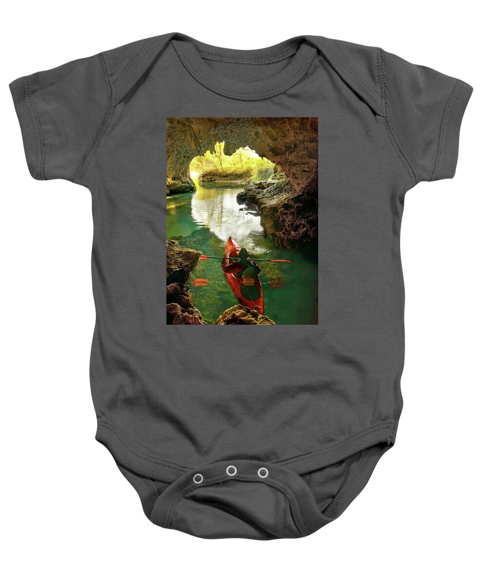 Kayak Baby Onesie featuring the photograph paddling in Cave Spring by Robert Charity