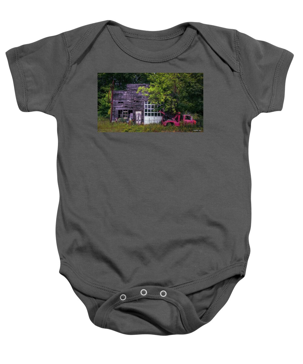 Garage Baby Onesie featuring the photograph Remains of an Old Tow Truck and Garage by Ken Morris