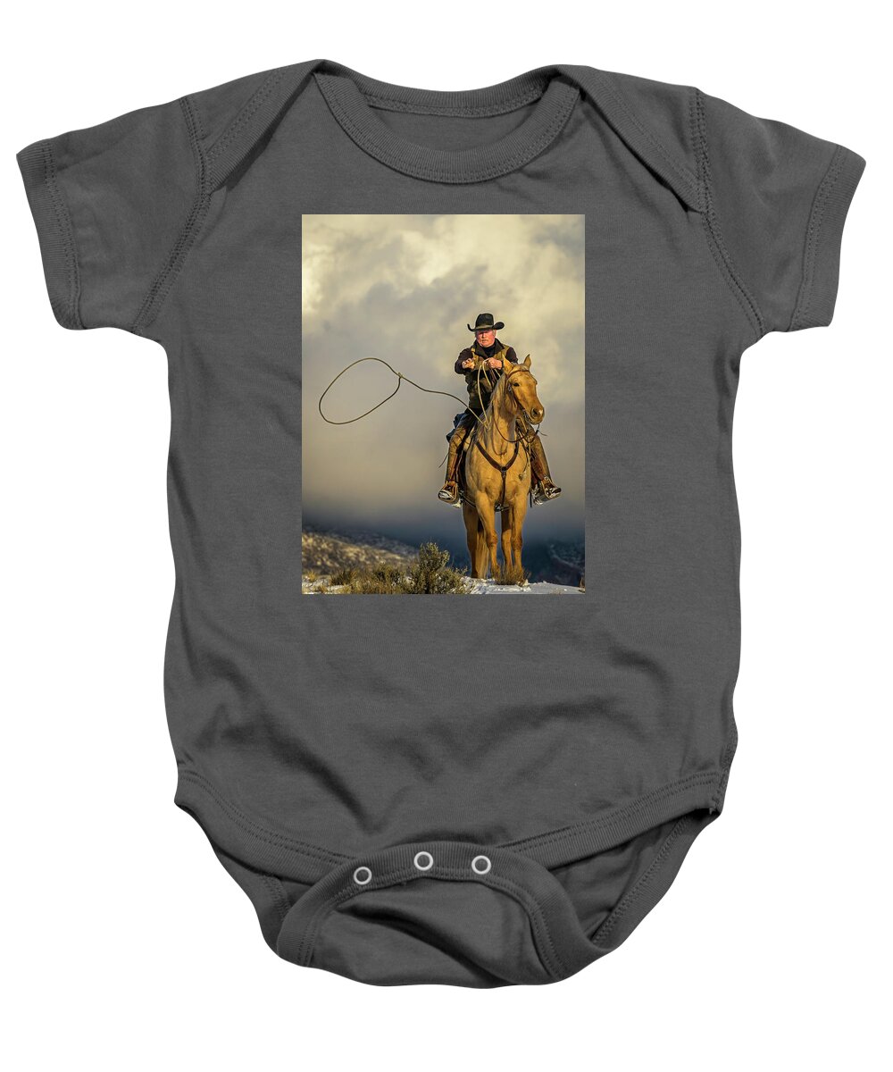 Cowboy Baby Onesie featuring the photograph Ropin the Wind by Laura Hedien
