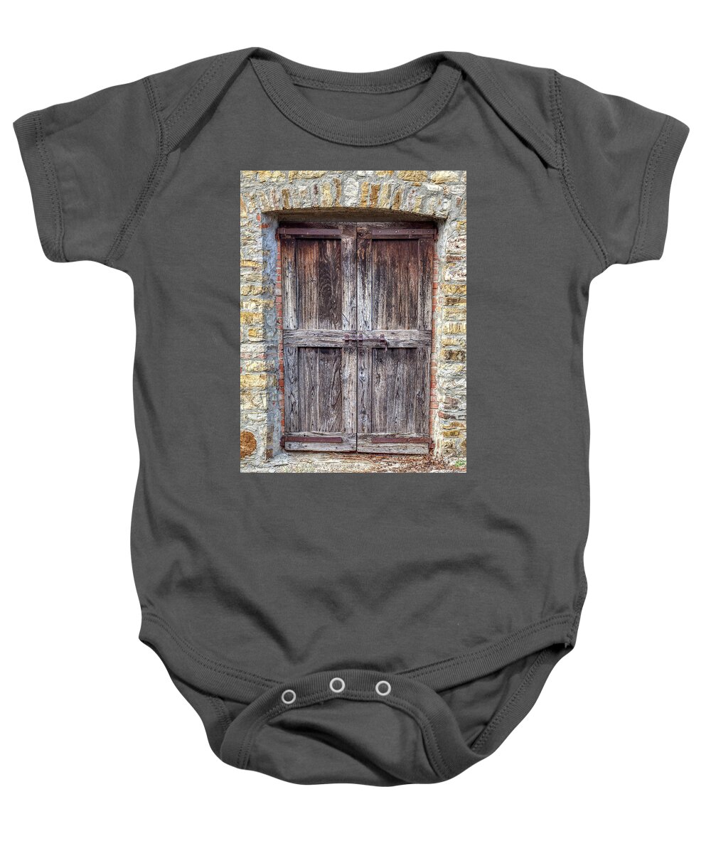 Door Baby Onesie featuring the photograph Rustic Weathered Brown Wood Door by David Letts