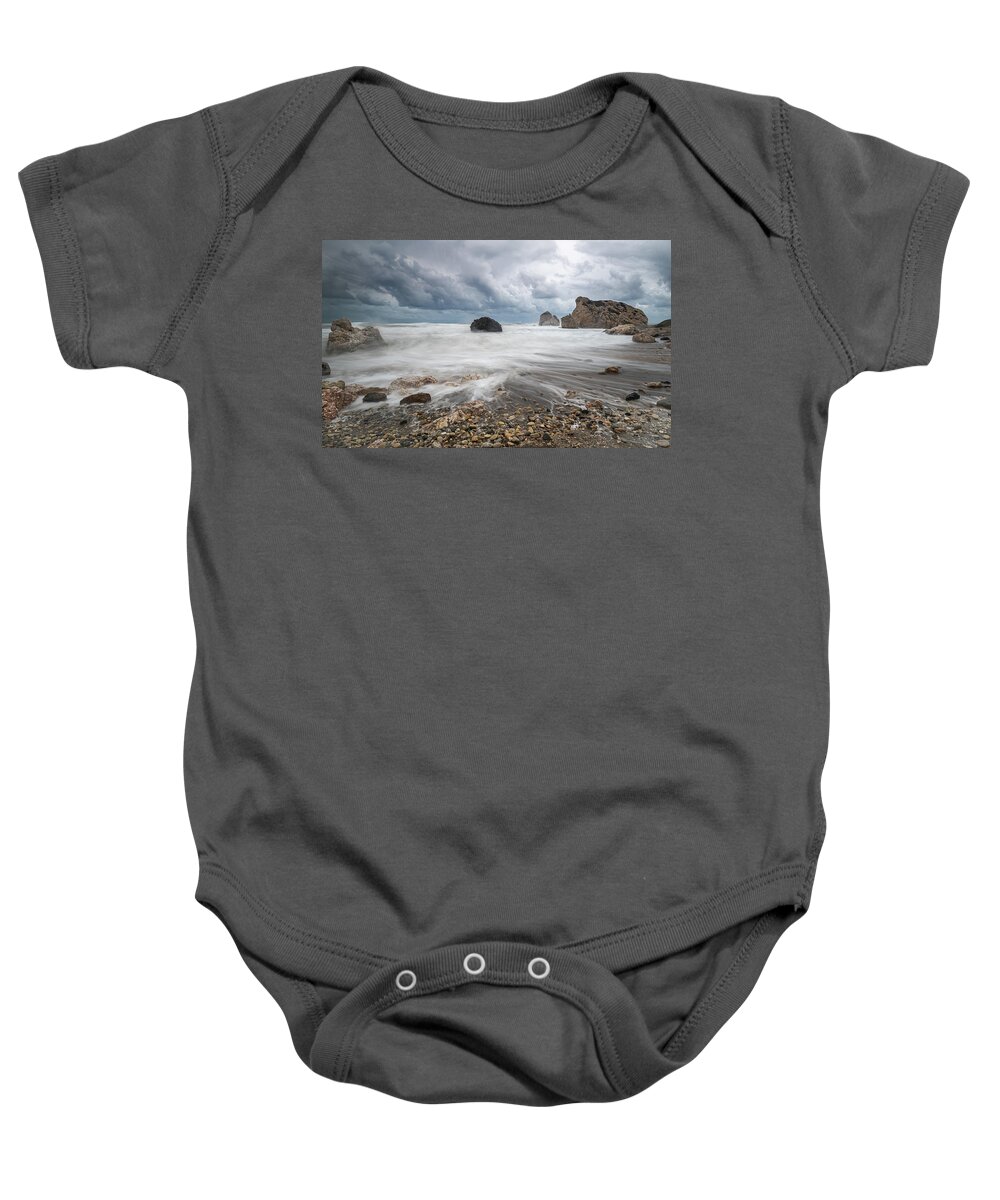 Seascape Baby Onesie featuring the photograph Seascape with windy waves during storm weather at the a rocky co by Michalakis Ppalis