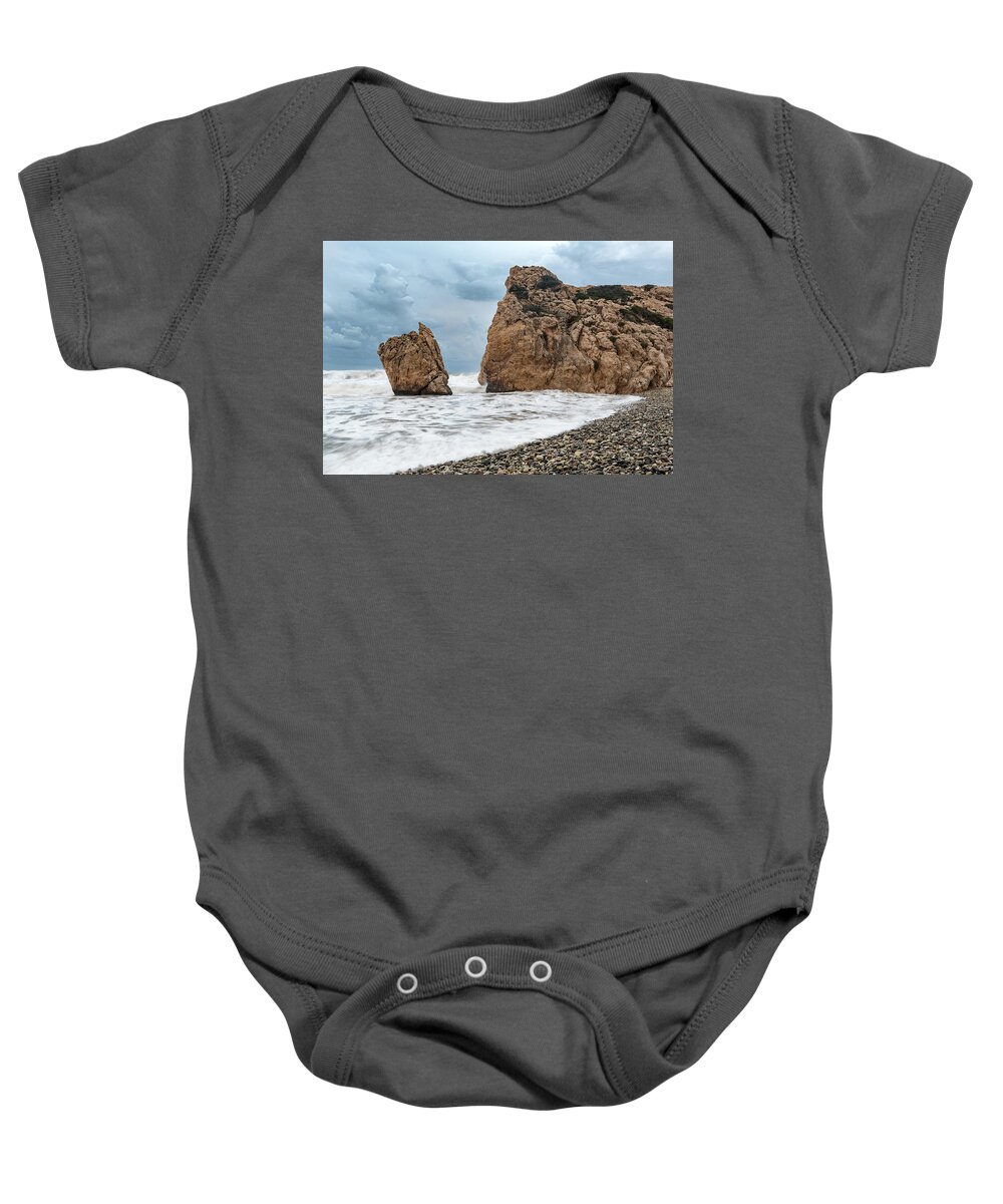 Coastline Baby Onesie featuring the photograph Seascapes with windy waves. Rock of Aphrodite Paphos Cyprus by Michalakis Ppalis