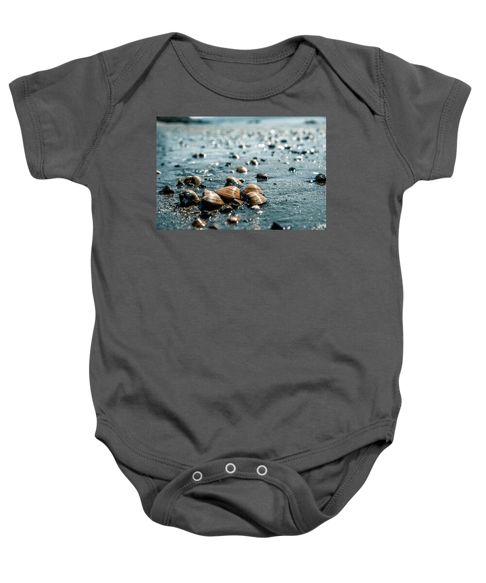 Art Baby Onesie featuring the photograph Shells On a Wet Sandy Beach Along The Columbia River by Jason McPheeters