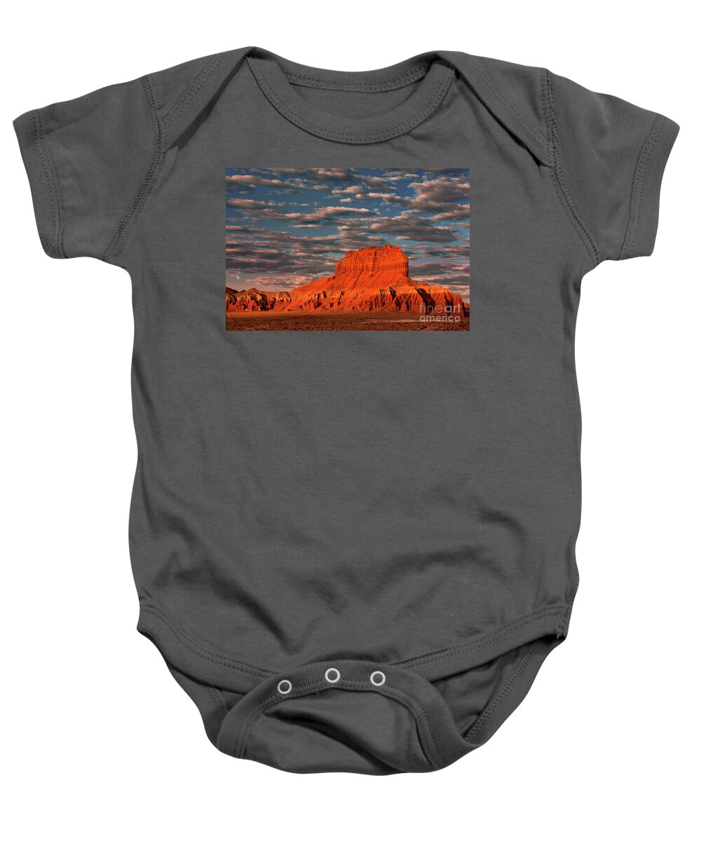 Dave Welling Baby Onesie featuring the photograph Sunrise Lights Up Wild Horse Butte Goblin Valley Utah by Dave Welling