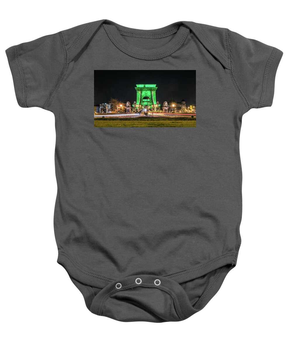Budapest Baby Onesie featuring the photograph The Chain Bridge in Budapest illuminated in Kelly Green for St. Patrick's Day. by Tito Slack
