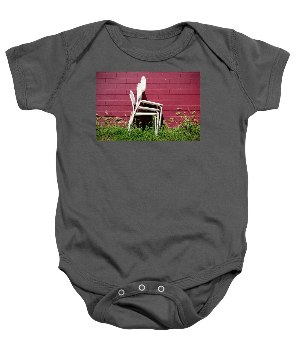 Chairs Baby Onesie featuring the photograph Three White Chairs and a Red Brick Wall by Mary Lee Dereske