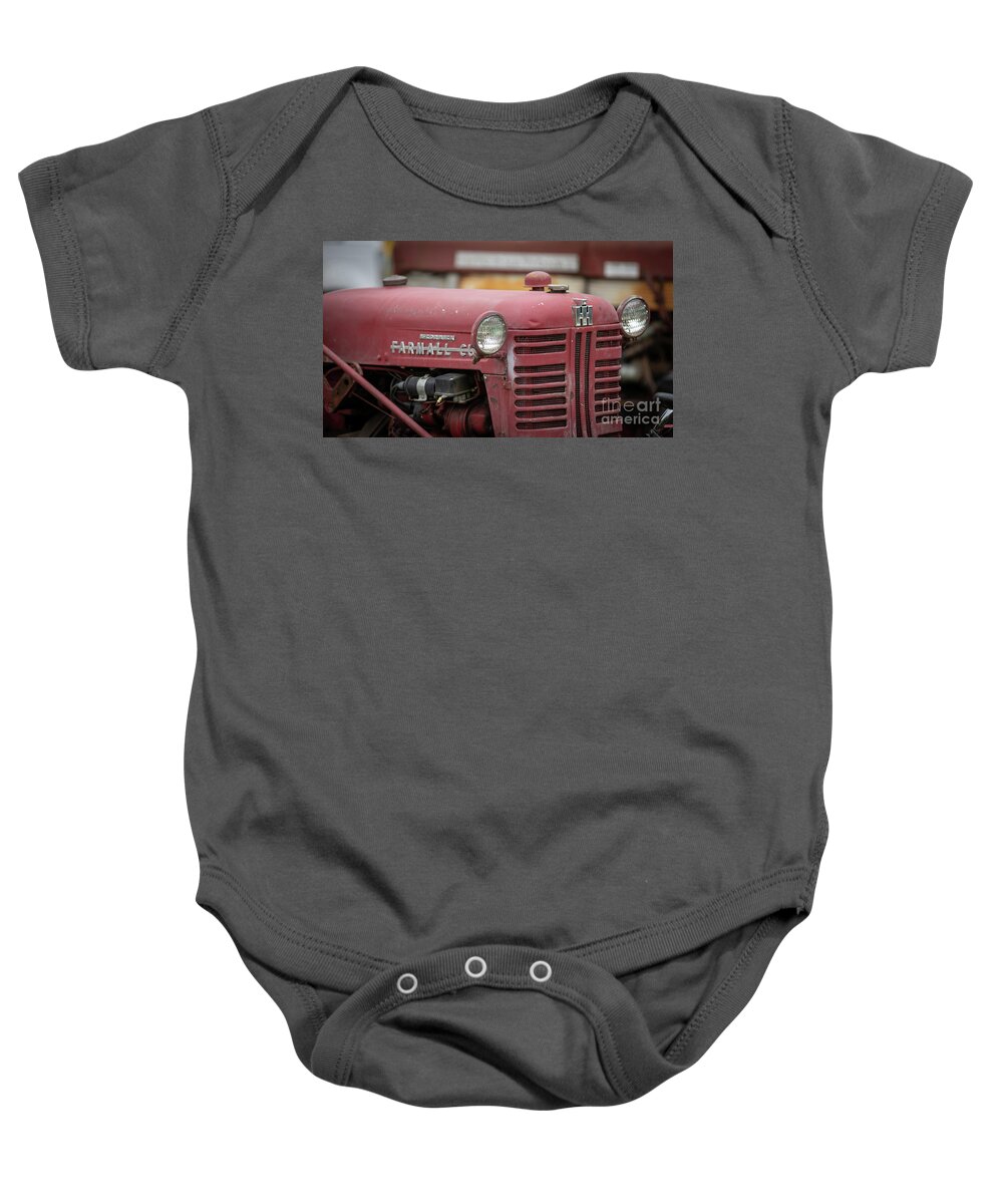 Tractor Baby Onesie featuring the photograph Vintage Tractor Farmall Film Fade II by Edward Fielding