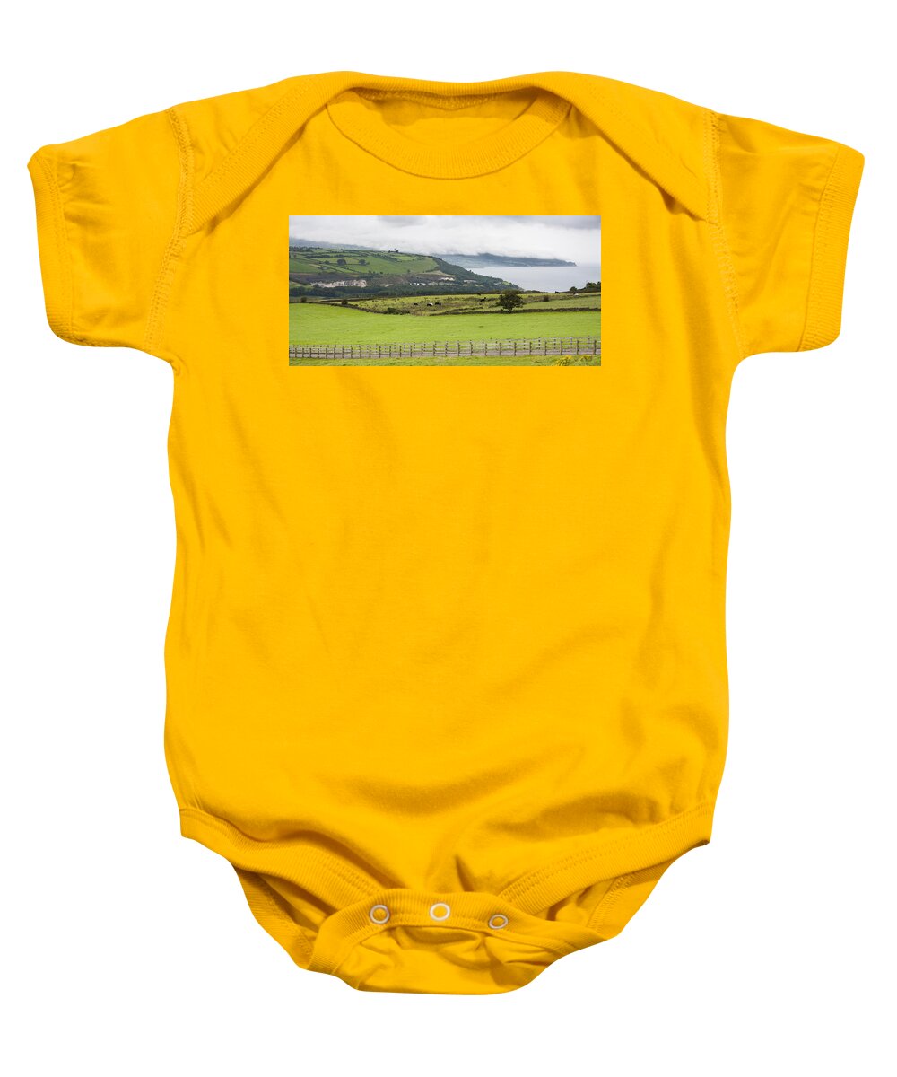 Animal Baby Onesie featuring the photograph Causeway Coastal Route in Northern Ireland by Semmick Photo