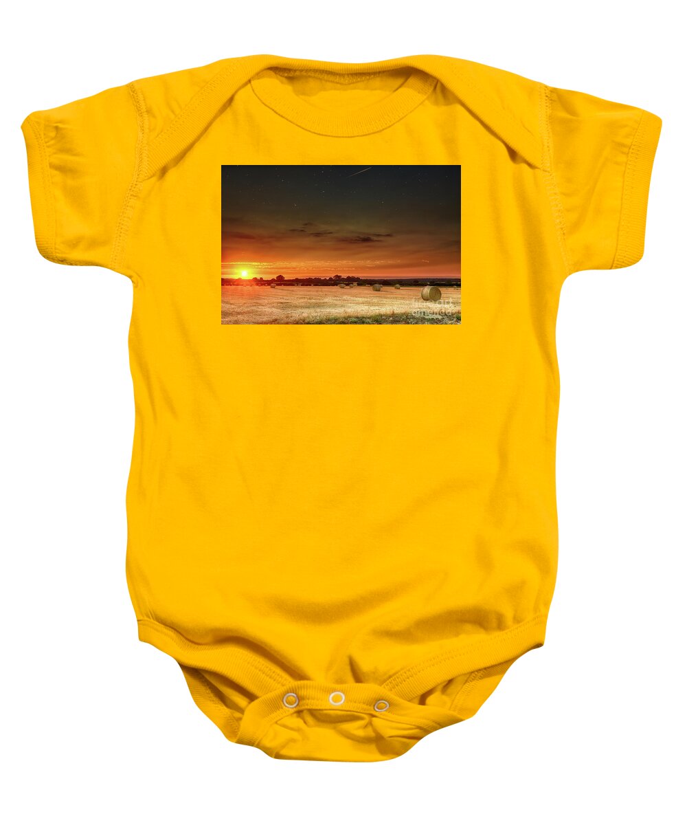 Sunset Baby Onesie featuring the photograph Hay bales at sunset and stars by Simon Bratt