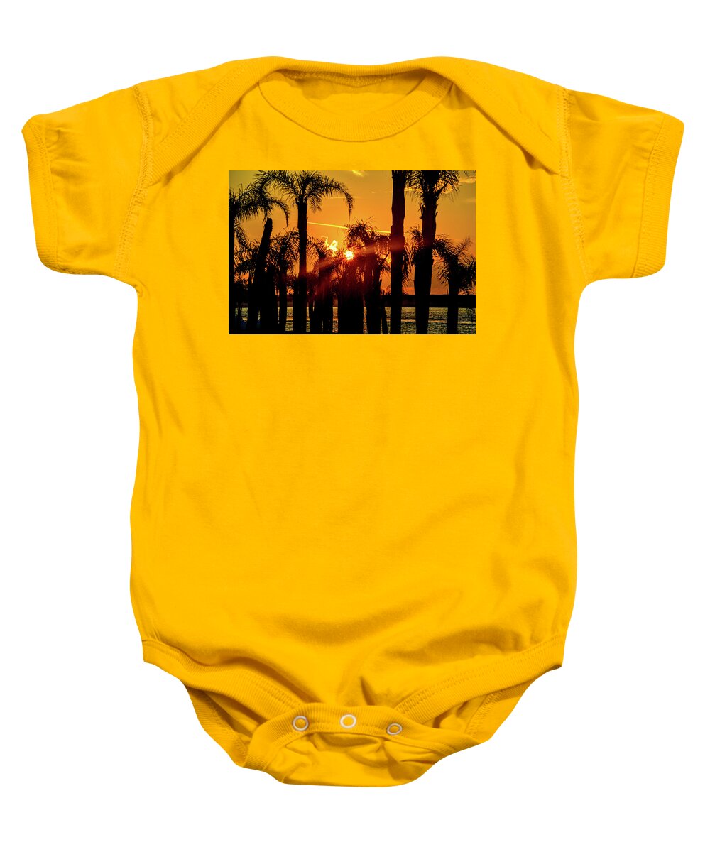 Alabama Baby Onesie featuring the photograph Stack of Palms in a Orange Sky by Michael Thomas
