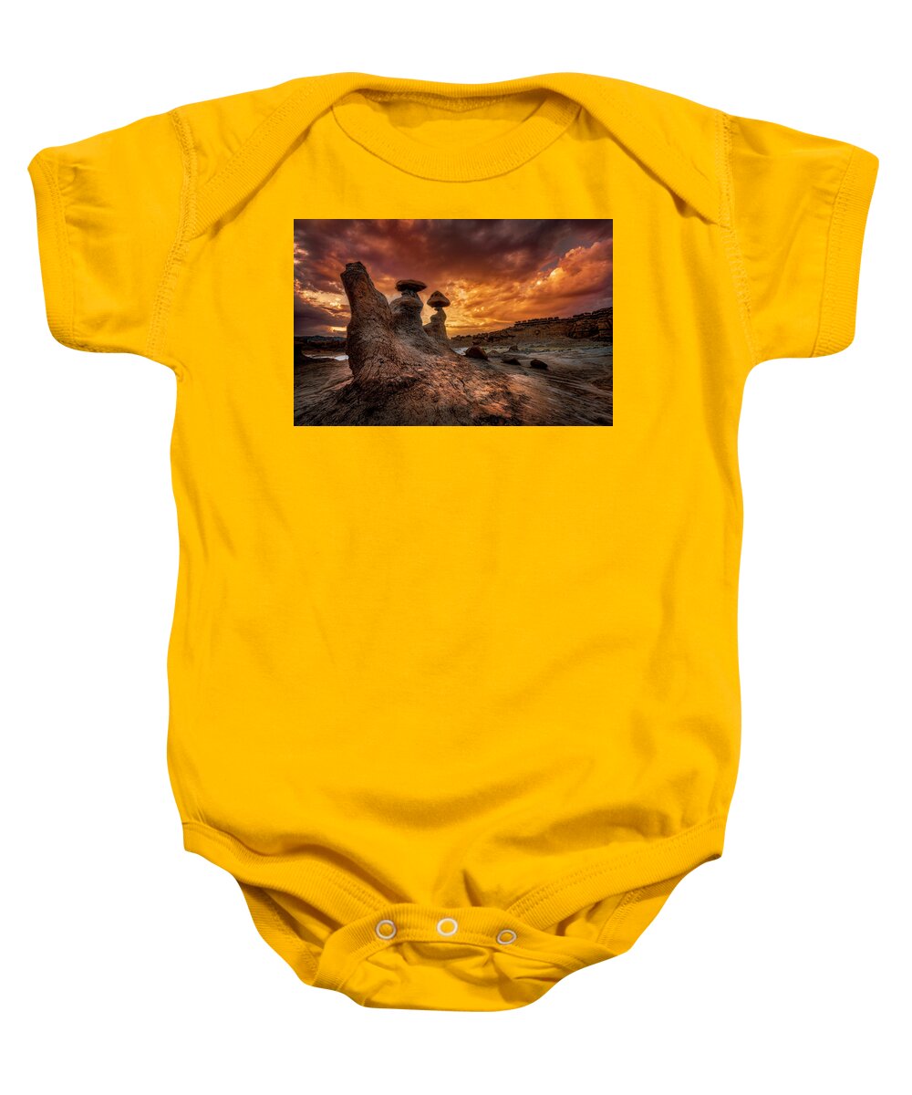 Goblin Valley Baby Onesie featuring the photograph Sunset at Goblin Valley by Michael Ash