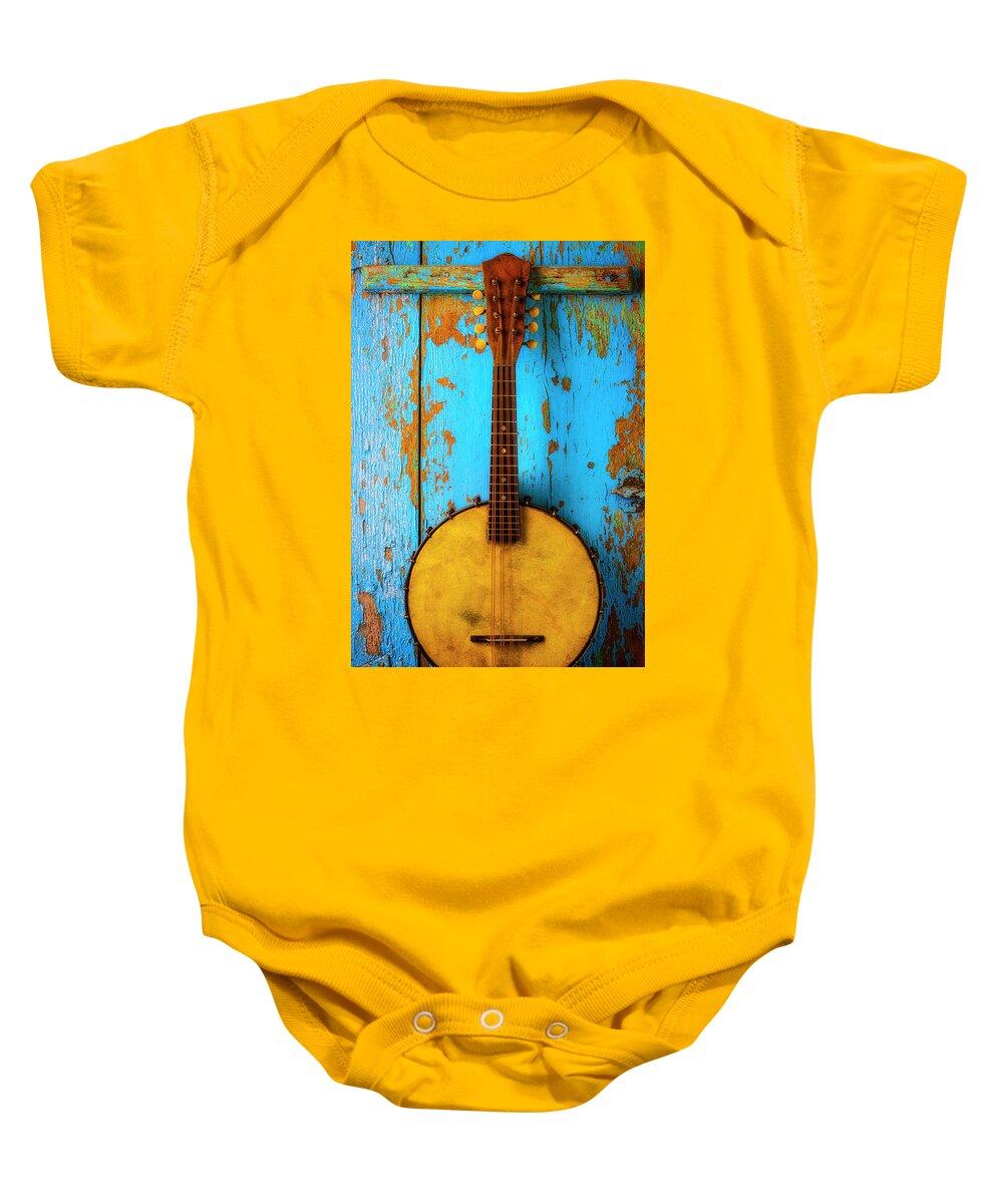 American Baby Onesie featuring the photograph Old Banjo On Blue Wall by Garry Gay