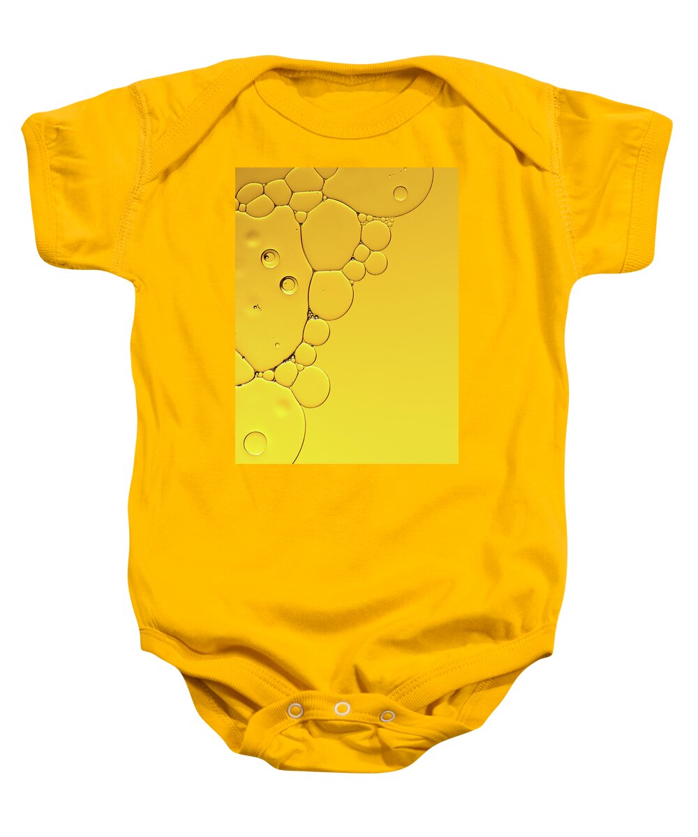 Fluid Baby Onesie featuring the photograph Abstract, image of oil, water and soap with colourful background by Michalakis Ppalis