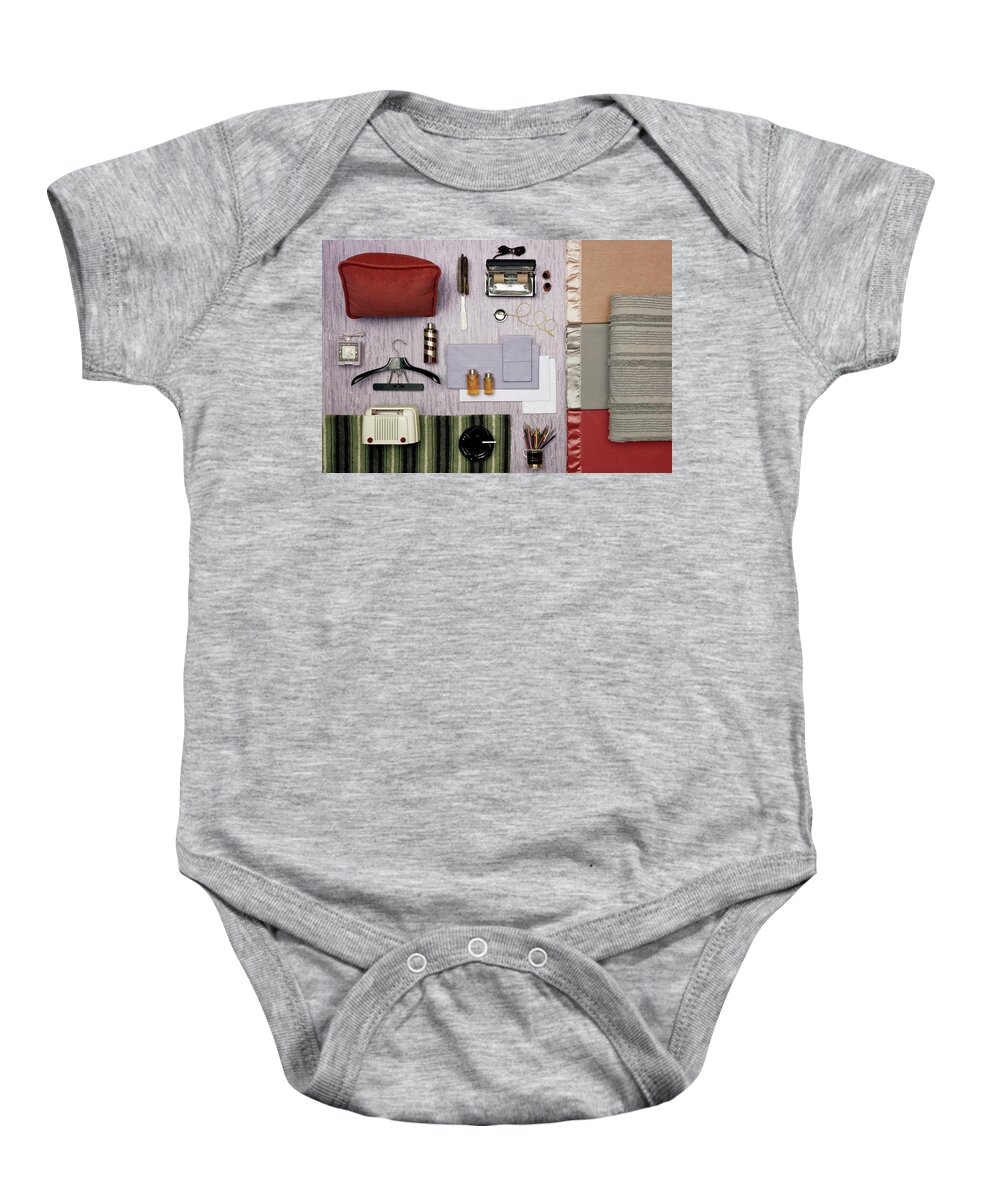 Studio Shot Baby Onesie featuring the photograph A Group Of Household Objects #1 by Geoffrey Baker