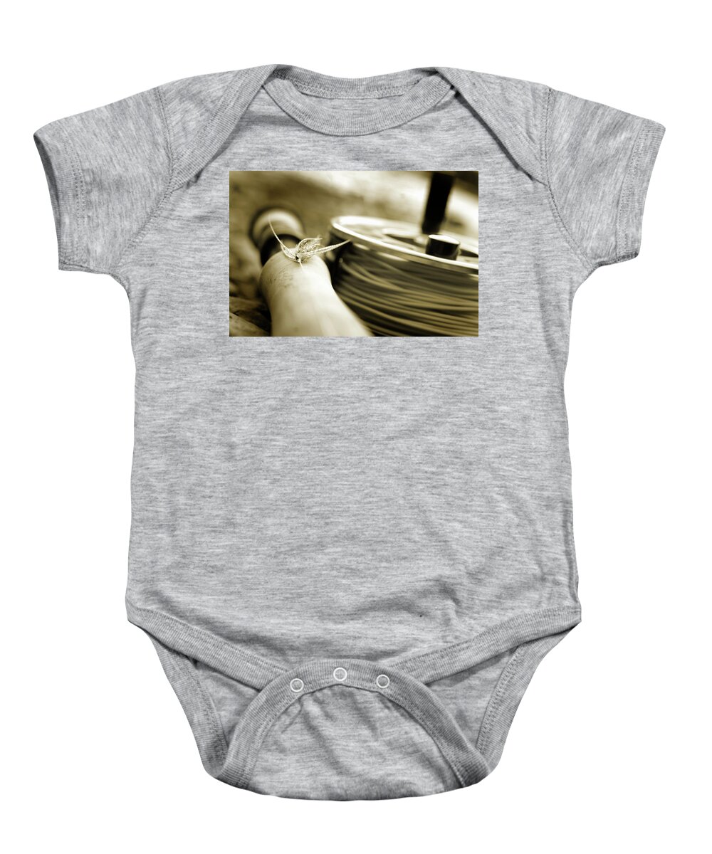 Close-up Of Fly Fishing Reel #3 Onesie by Justin Bailie - Pixels Merch