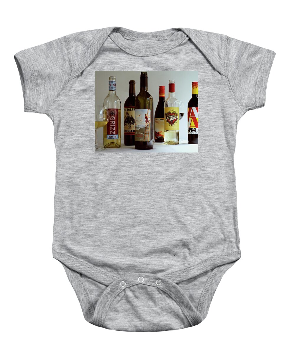 Food Baby Onesie featuring the photograph A Collection Of Wine Bottles by Romulo Yanes