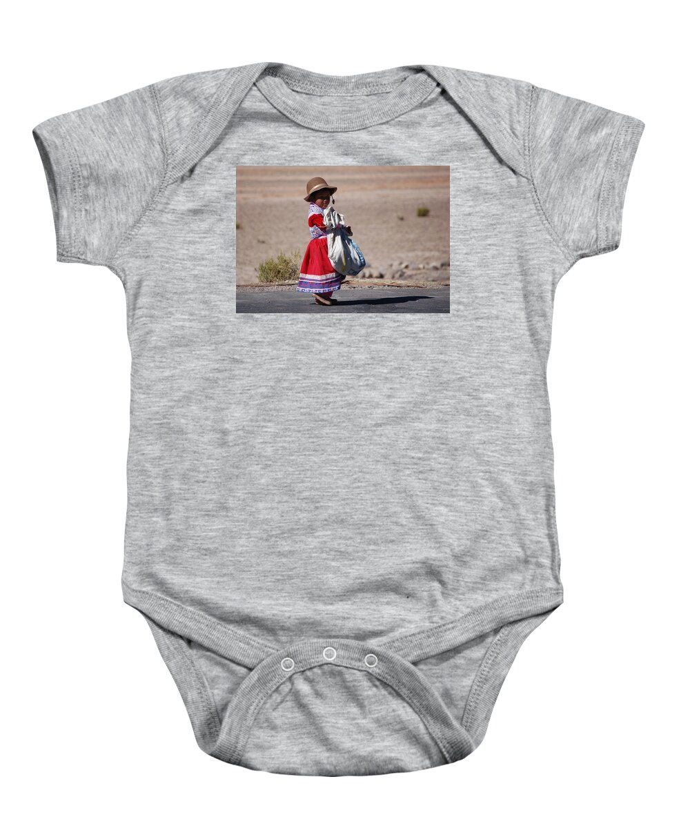 Girl Baby Onesie featuring the photograph A little girl in the high plain by RicardMN Photography
