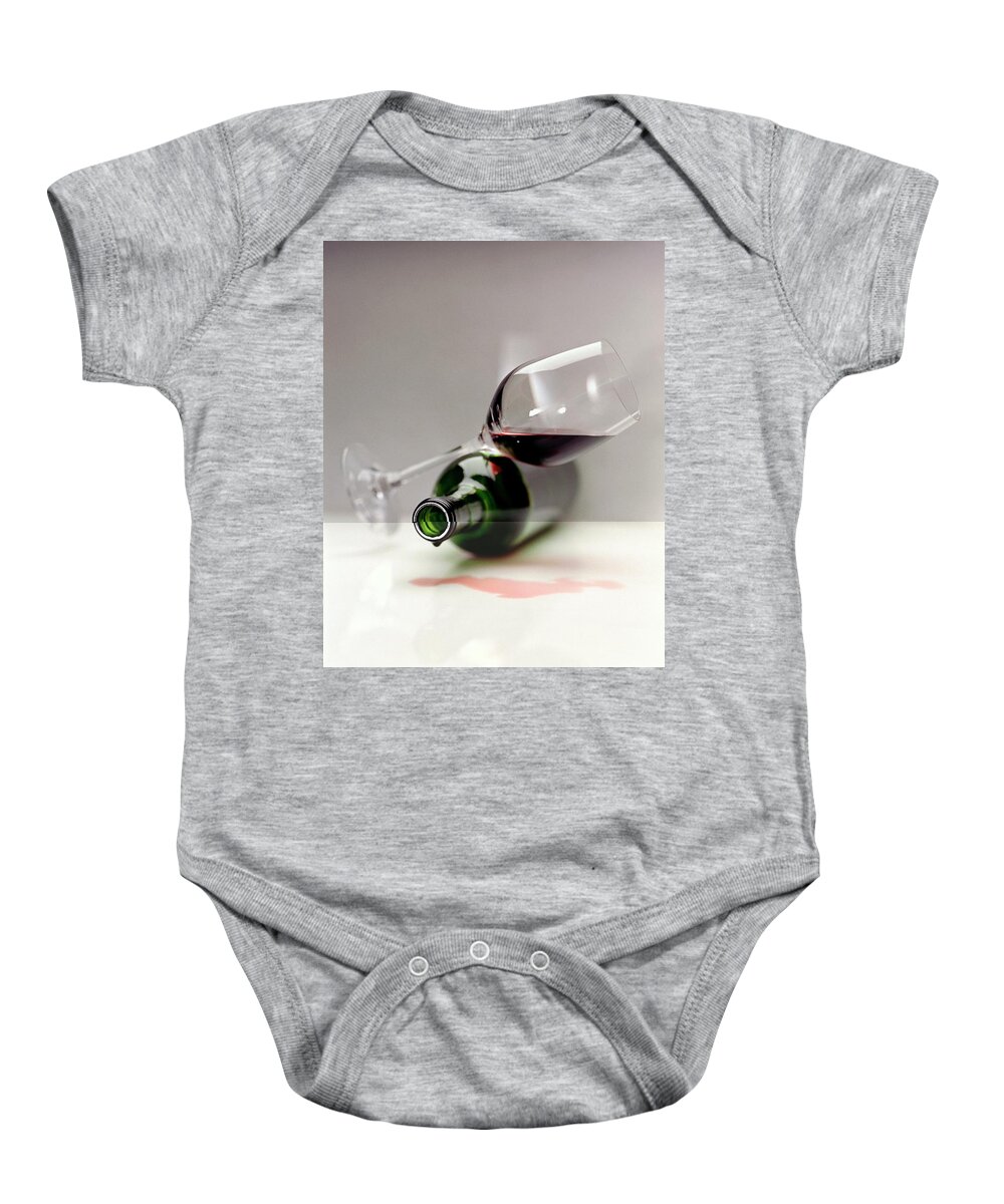 Beverage Baby Onesie featuring the photograph A Wine Bottle And A Glass Of Wine by Romulo Yanes