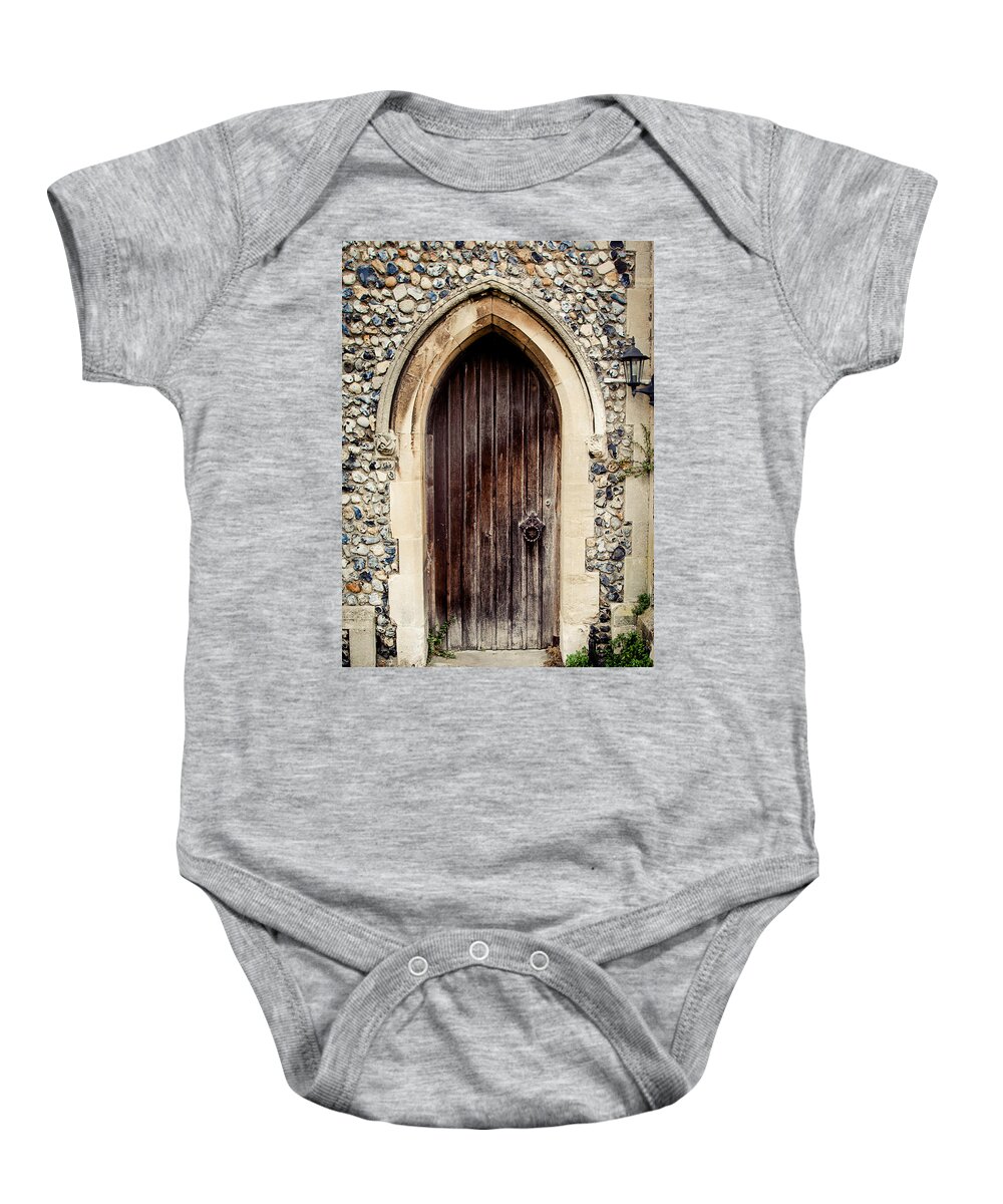 All Saints Church Baby Onesie featuring the photograph All Saints Church Door by Karen Varnas