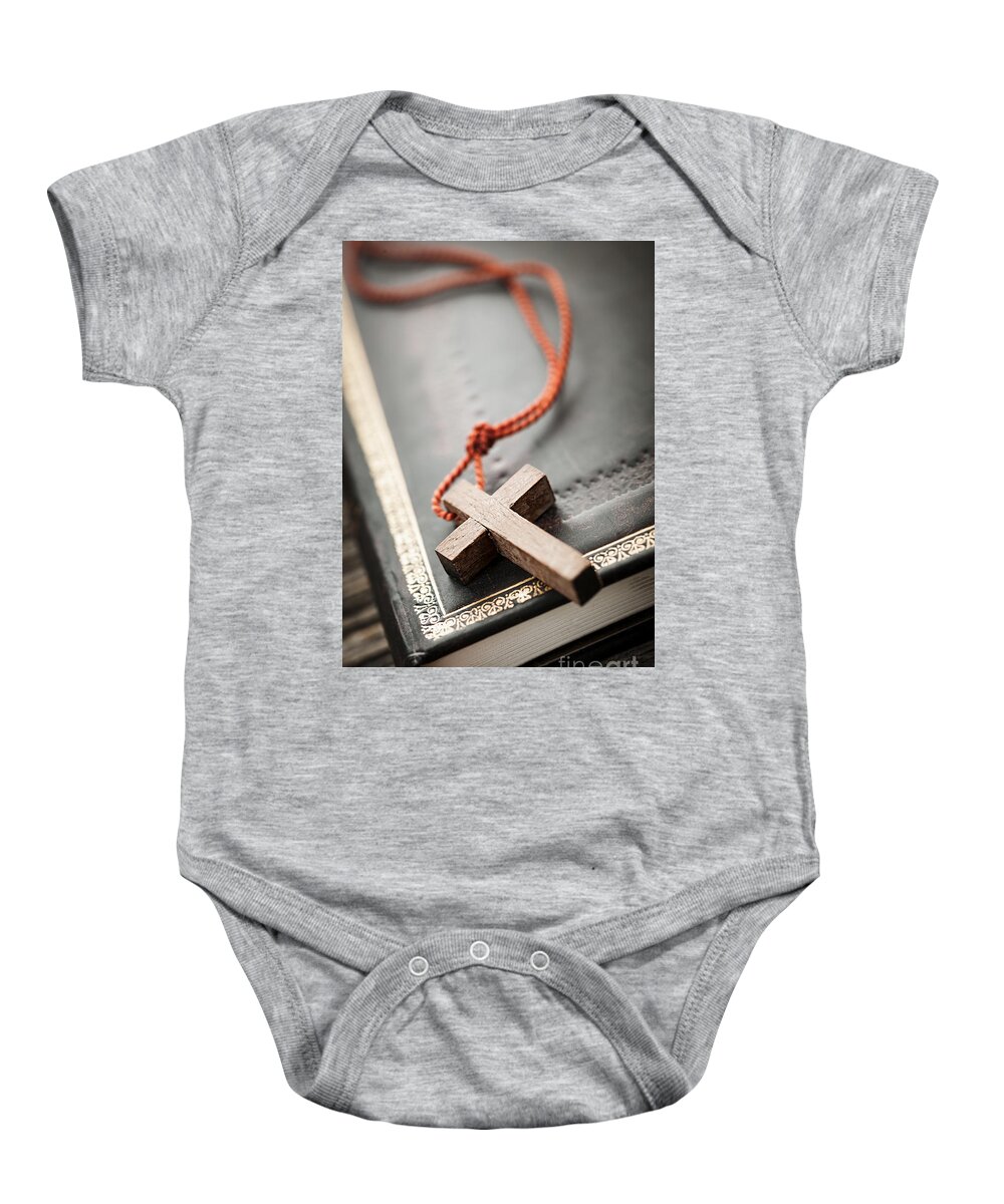 Cross Baby Onesie featuring the photograph Cross on Bible 3 by Elena Elisseeva