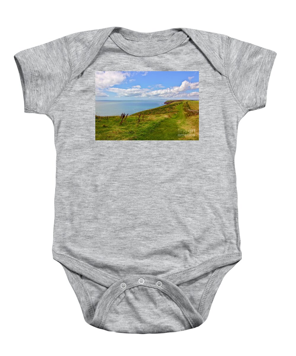 Tenby Baby Onesie featuring the photograph Edge of the World by Jeremy Hayden