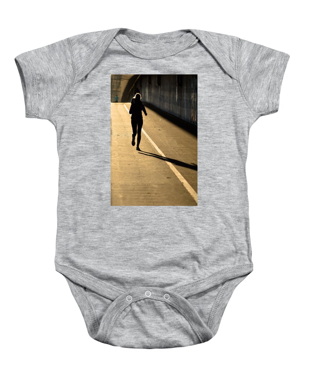Girl Baby Onesie featuring the photograph Female Jogger In Backlight by Andreas Berthold