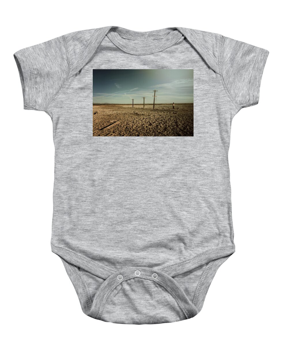 Niland Baby Onesie featuring the photograph It Was a Strange Day by Laurie Search