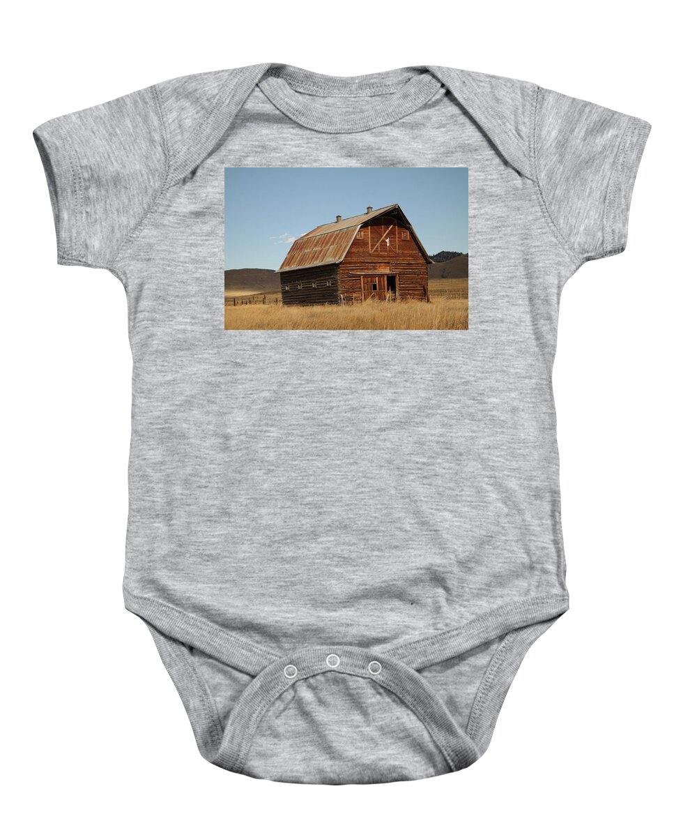 Barn Baby Onesie featuring the photograph Log barn by Jeff Swan