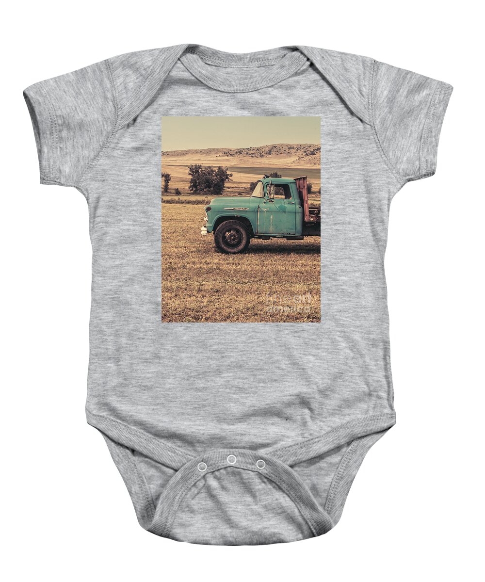 Ranch Baby Onesie featuring the photograph Old Hay truck in the field by Edward Fielding