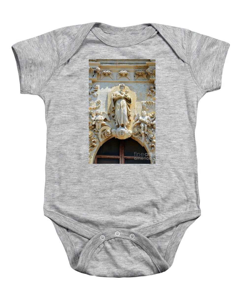 San Antonio Baby Onesie featuring the photograph Saint Joseph Holding Baby Jesus above the entrance to Mission San Jose in San Antonio Texas by Shawn O'Brien