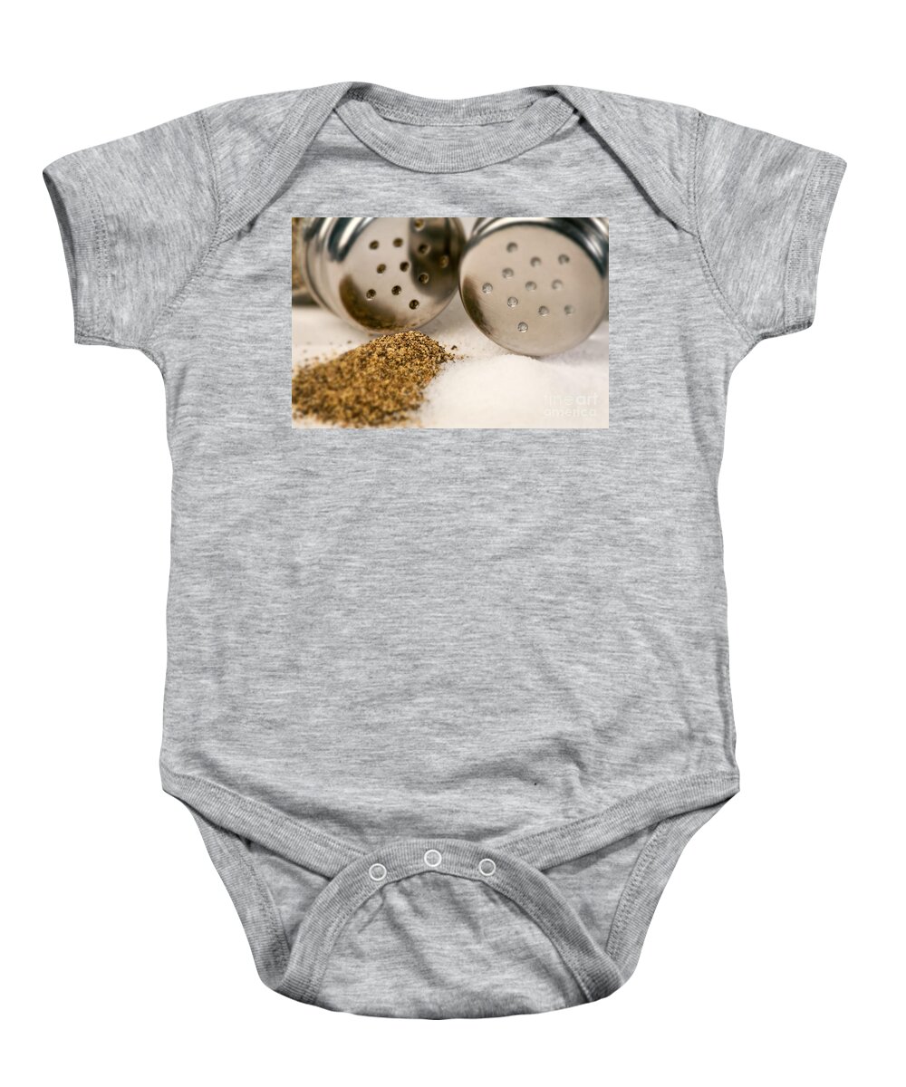 Iris Holzer Richardson Baby Onesie featuring the photograph Salt and Pepper Shaker spilled by Iris Richardson