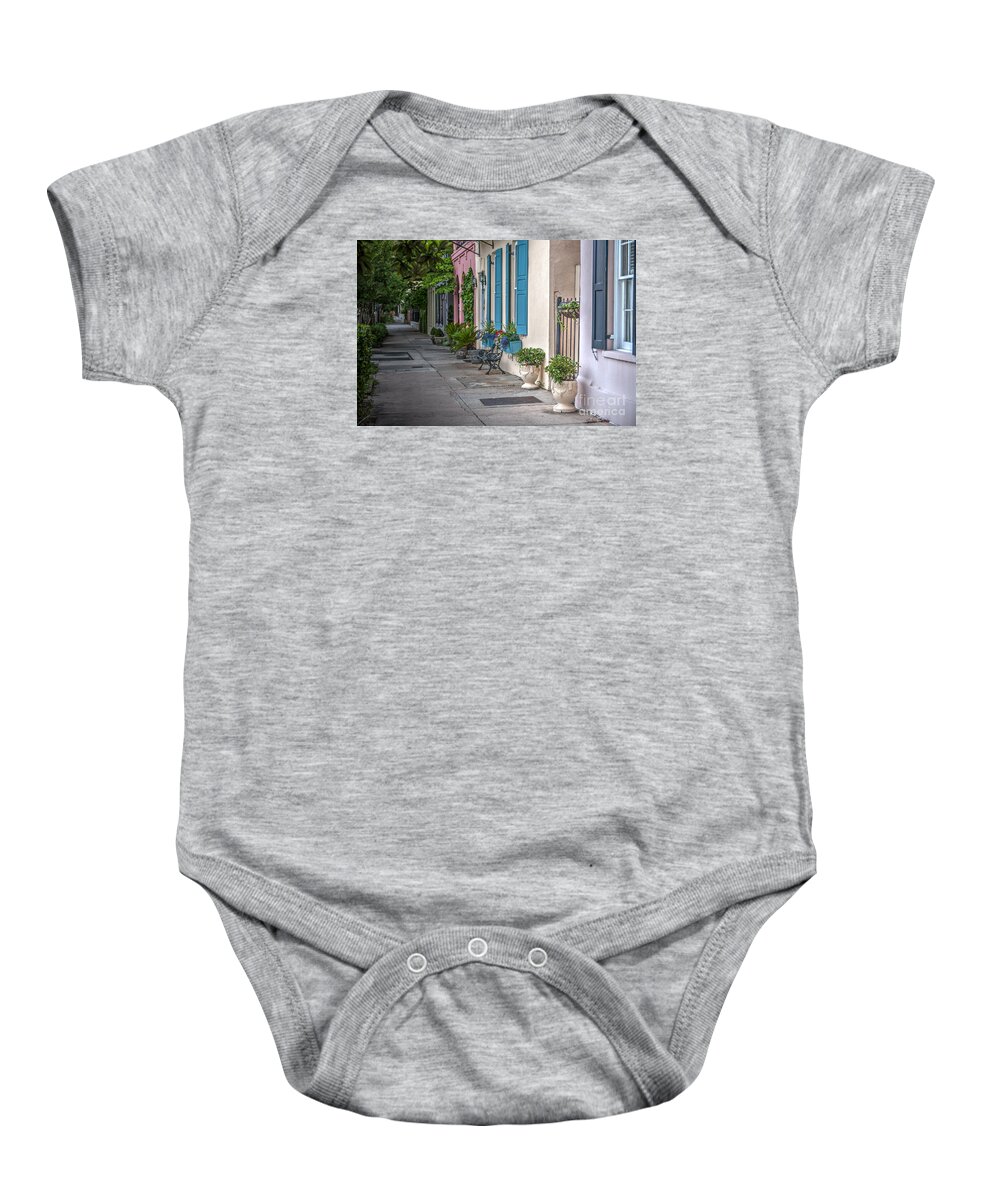 Rainbow Row Baby Onesie featuring the photograph Strolling Down Rainbow Row by Dale Powell