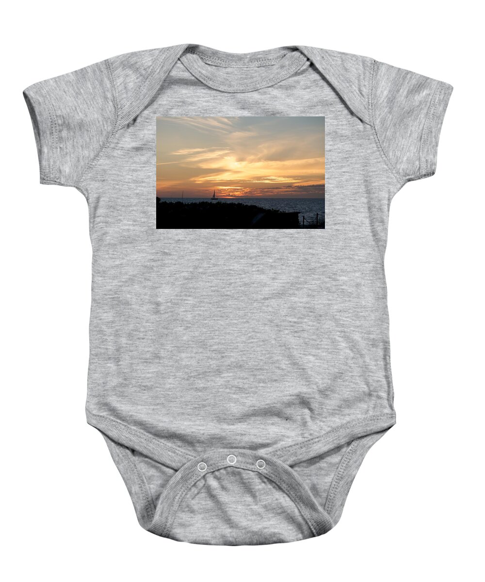Sunset And Sailboat Baby Onesie featuring the photograph Sunset at the Beach by Kristin Hatt