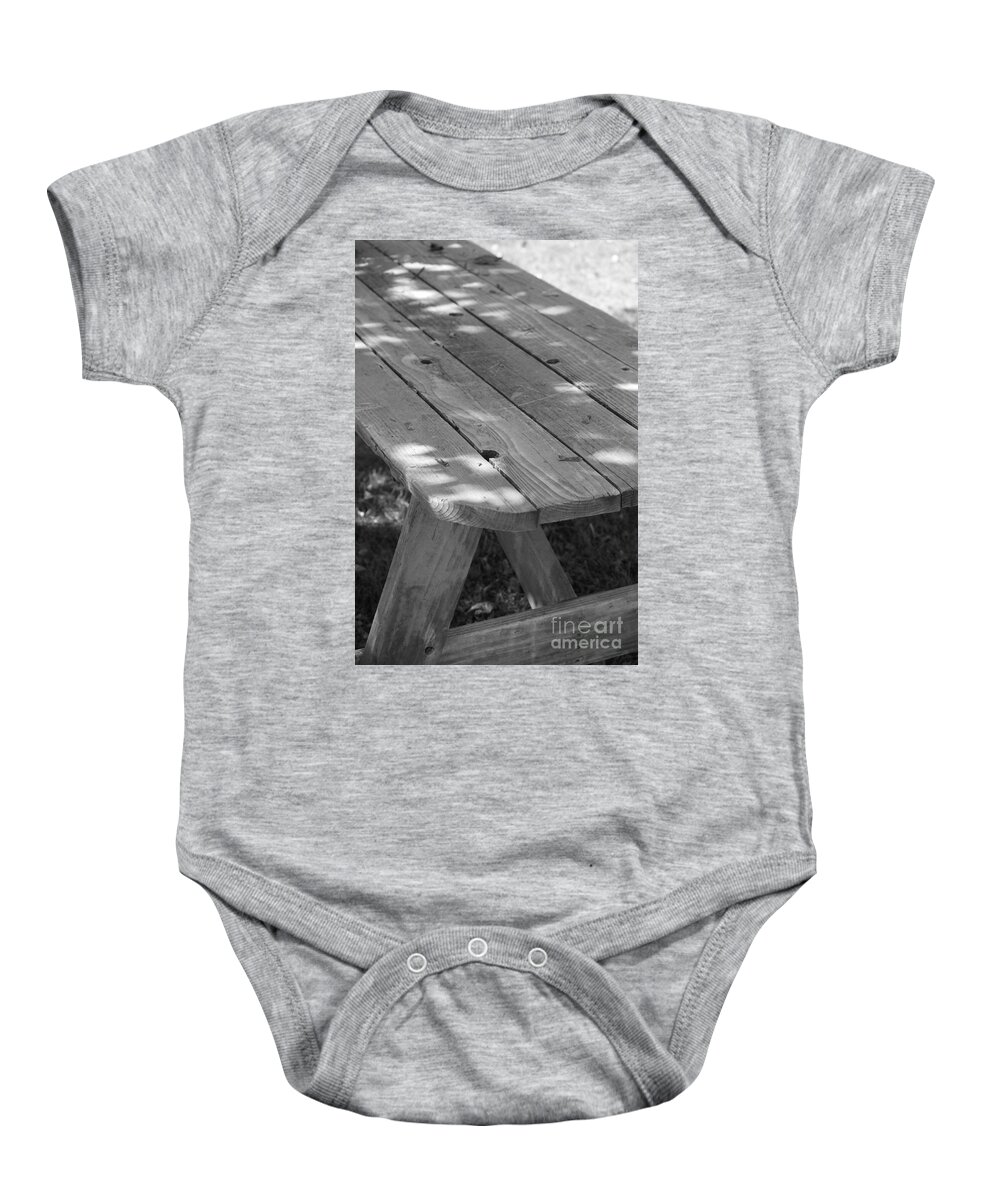 Black And White Baby Onesie featuring the photograph The Old Picnic Table by Jennifer E Doll