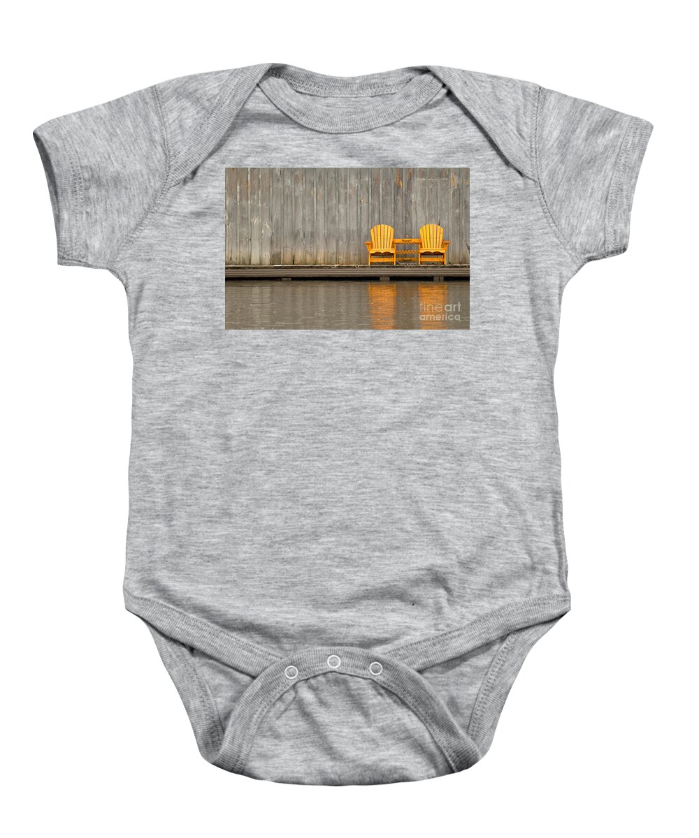 Two Baby Onesie featuring the photograph Two wooden chairs on an old dock by Les Palenik