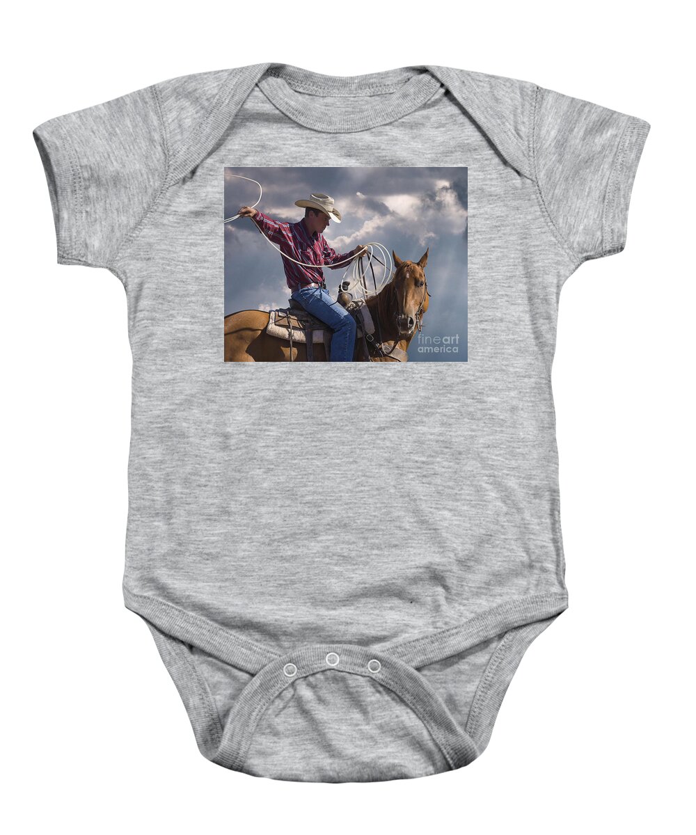 Warming Up To Rodeo Baby Onesie featuring the photograph Warming Up To Rodeo by Priscilla Burgers