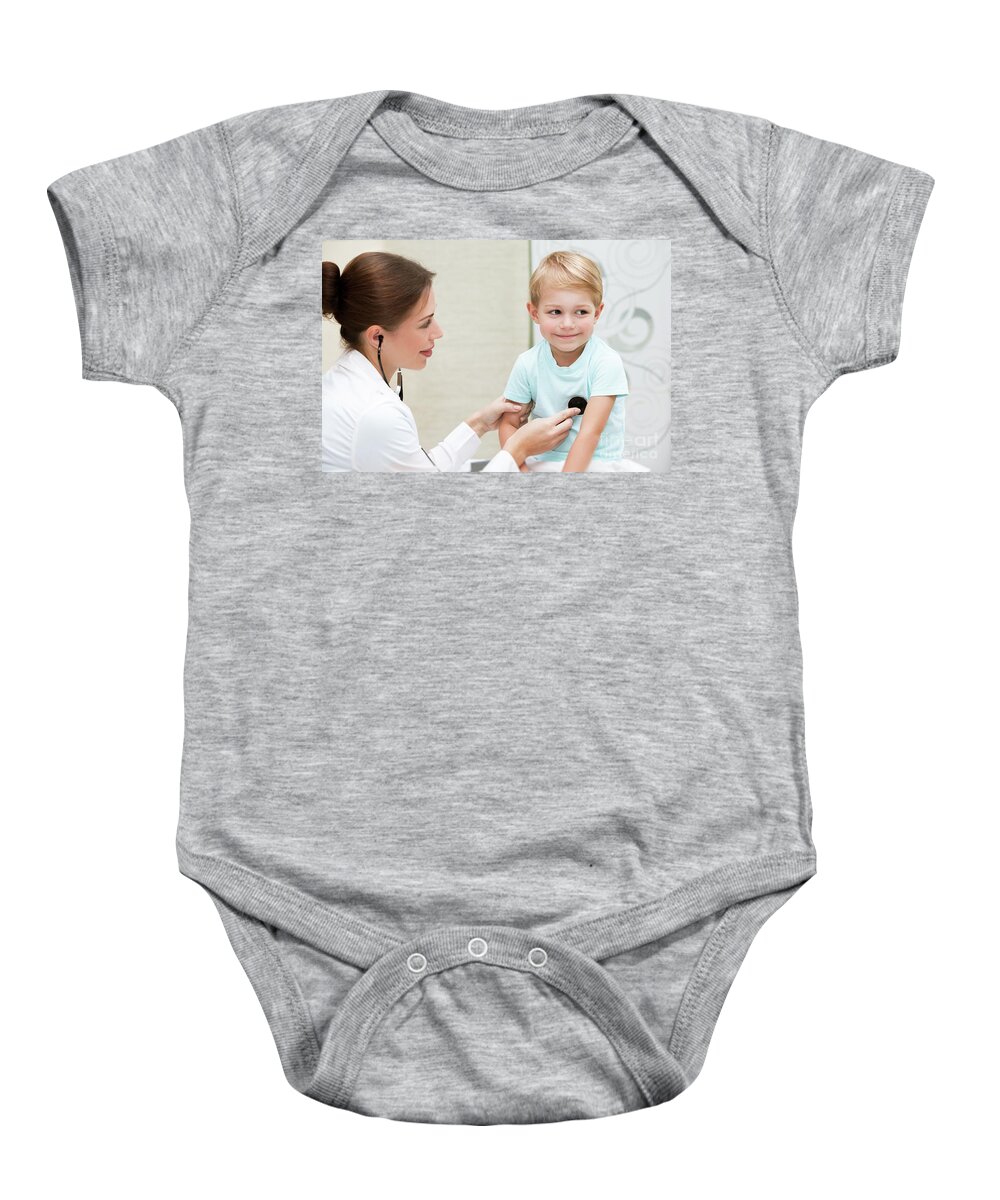 At Work Baby Onesie featuring the photograph Happy boy at the doctor #1 by Anna Om