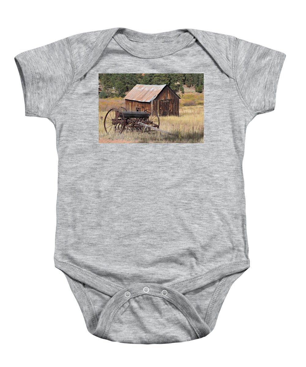 Old Baby Onesie featuring the photograph Seed Tiller - Barn Westcliffe CO by Margarethe Binkley