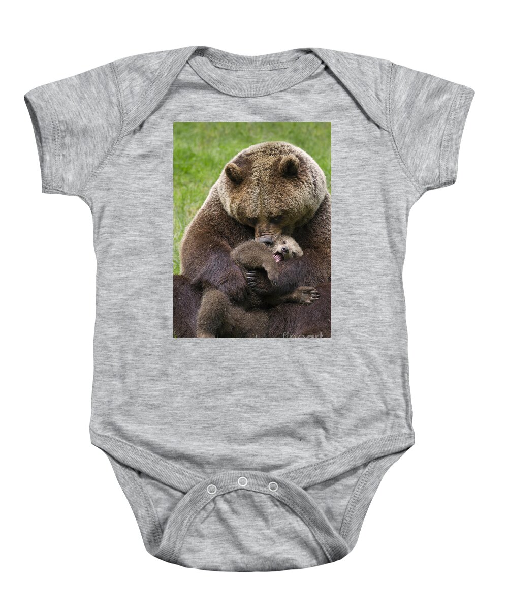 Cute Baby Onesie featuring the photograph Mother bear cuddling cub by Arterra Picture Library