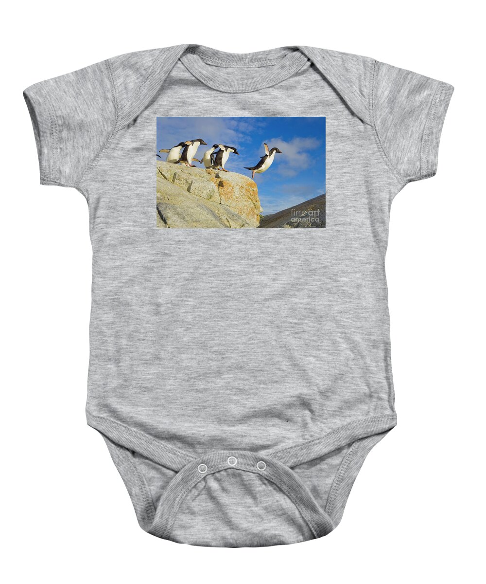 00345624 Baby Onesie featuring the photograph Adelie Penguins Jumping by Yva Momatiuk John Eastcott