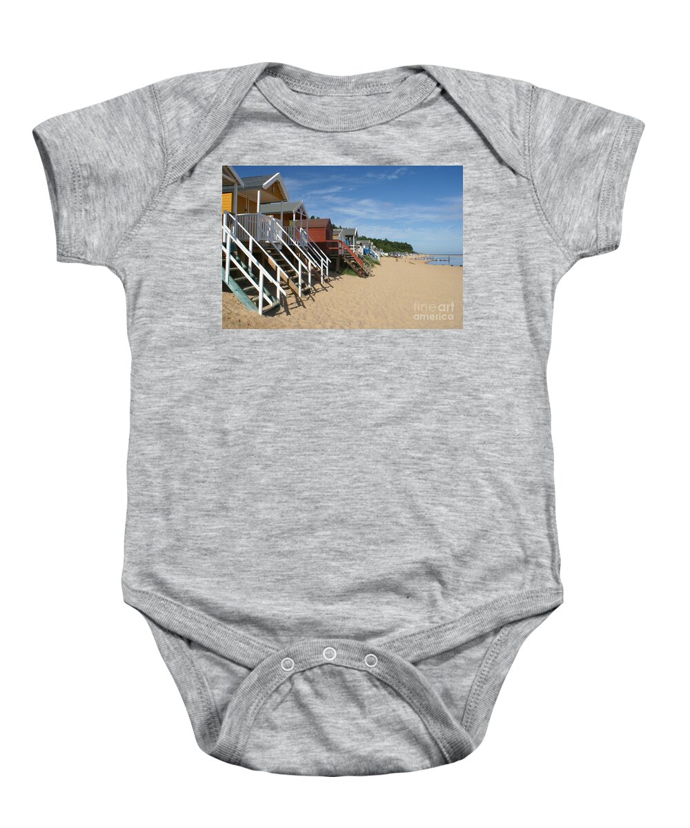 Beach Baby Onesie featuring the photograph Beach huts at Wells Next the Sea England. by David Birchall