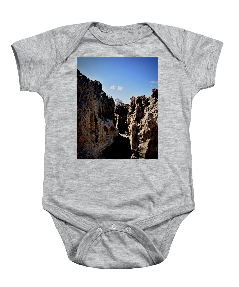 Rocks Baby Onesie featuring the photograph Between a Rock and a Hard Place by Carol Bradley