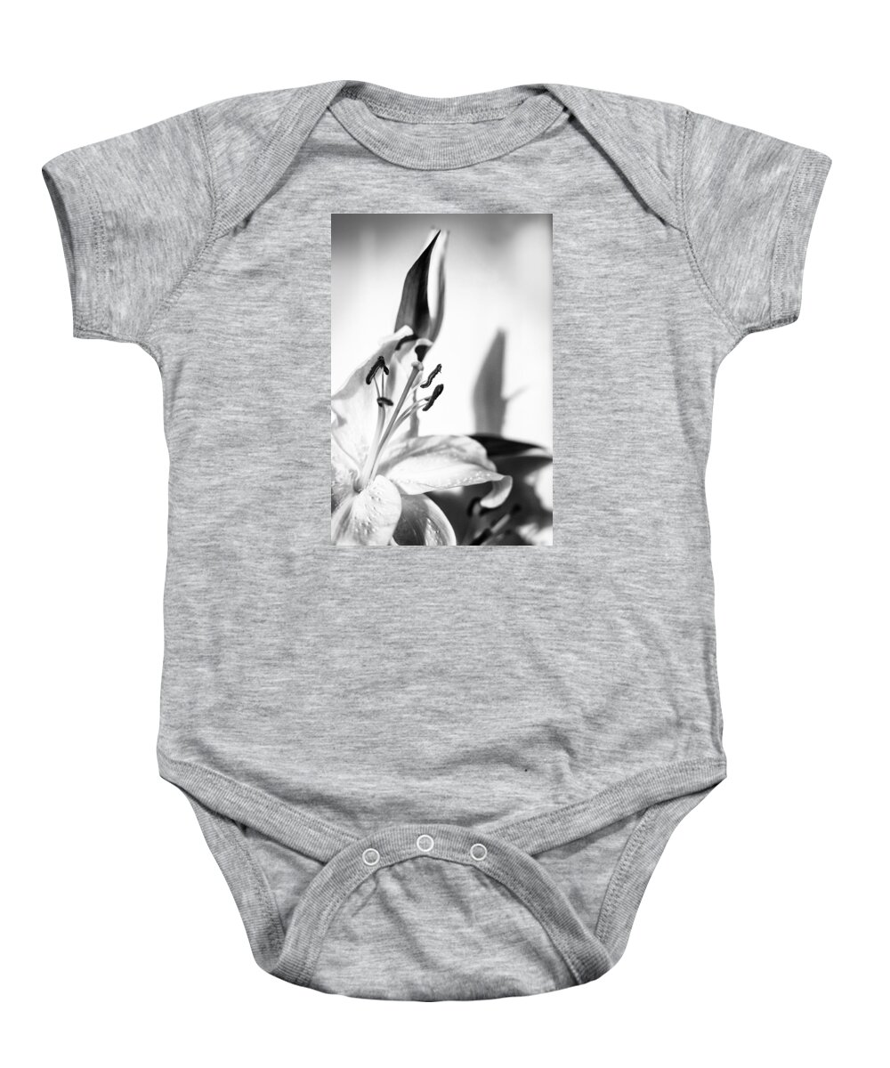 Lily Flower Baby Onesie featuring the photograph Blossoming White Lilly Flower and Shadow in Monochrome by John Williams