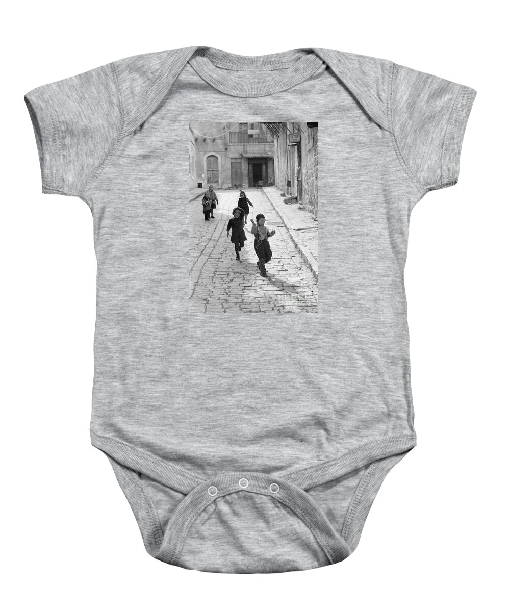 Israel Baby Onesie featuring the photograph Children Playing in Jerusalem, 1952 by The Harrington Collection