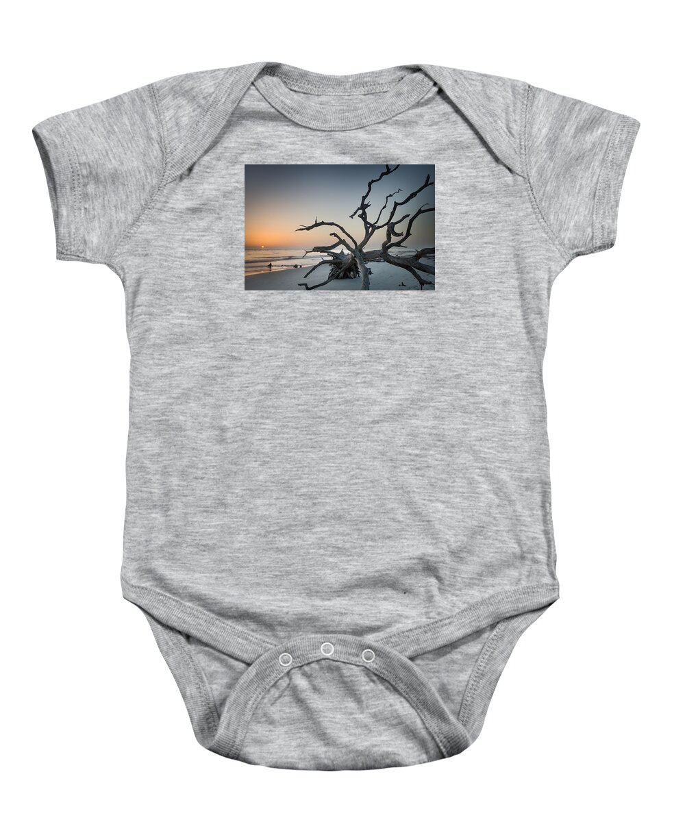 Sunrise Baby Onesie featuring the photograph Driftwood Sunrise by John Kirkland