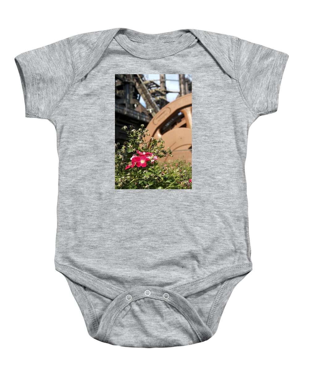 Bethlehem Steel Baby Onesie featuring the photograph Flowers and Steel by Michael Dorn